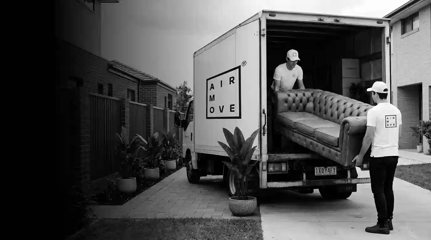 Movers_maneuvering_couch_into_truck